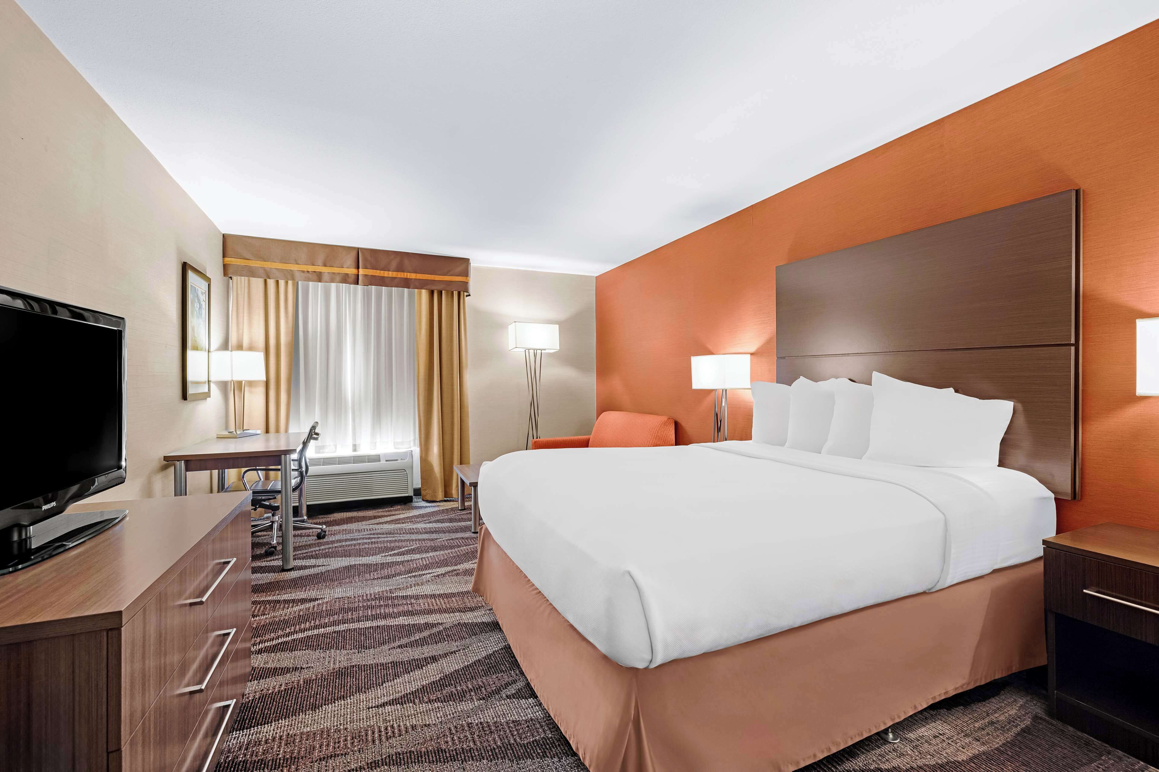 desk, laptop workspace, blackout curtains, iron/ironing board