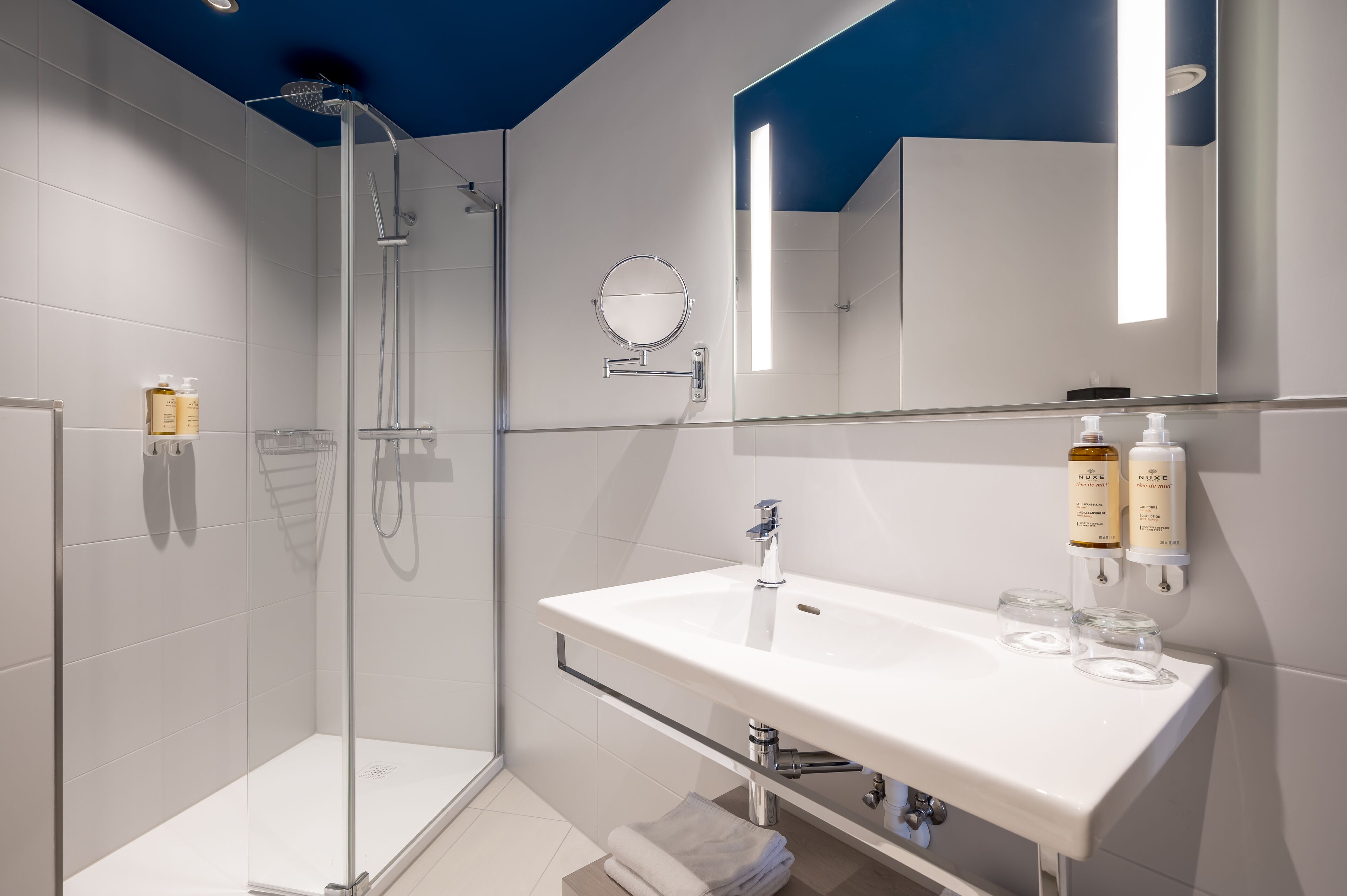 combined shower/bathtub, eco-friendly toiletries, hair dryer, bathrobes