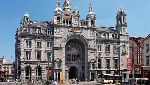 A historic building with a central archway and multiple towers. - Maek Hotel Antwerp Central - Handwritten Collection (Antwerp)