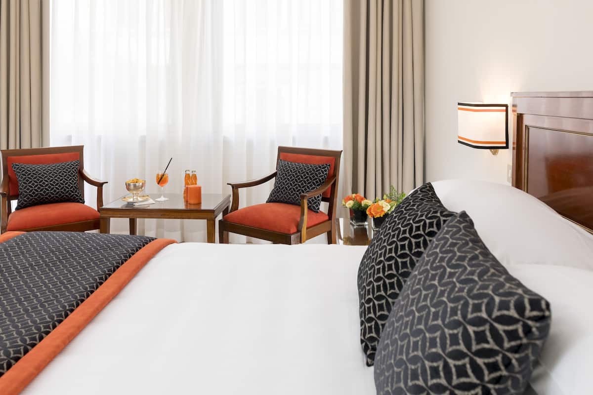 Friends and Family Room | 1 bedroom, minibar, in-room safe, individually decorated