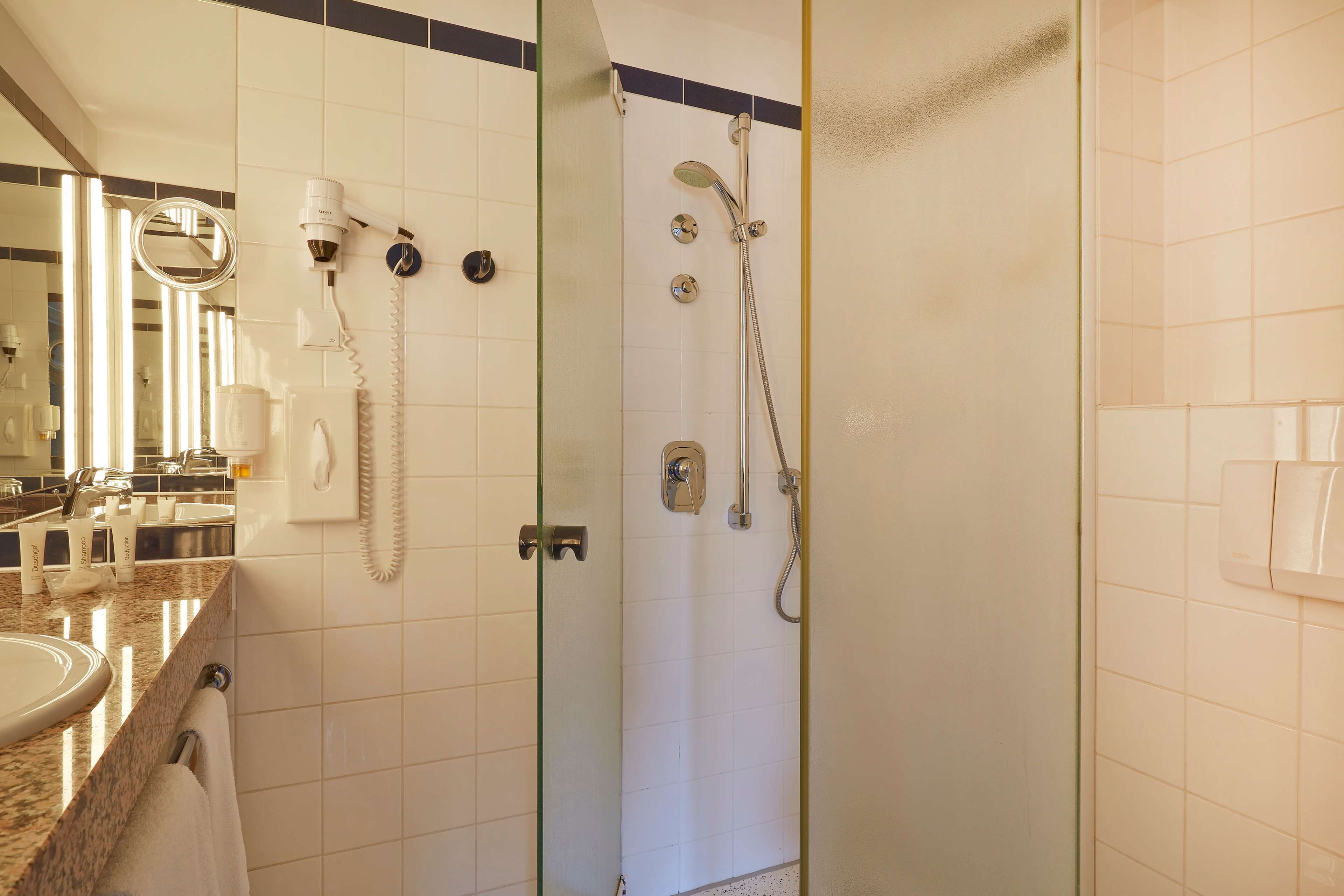 shower, eco-friendly toiletries, hair dryer, towels