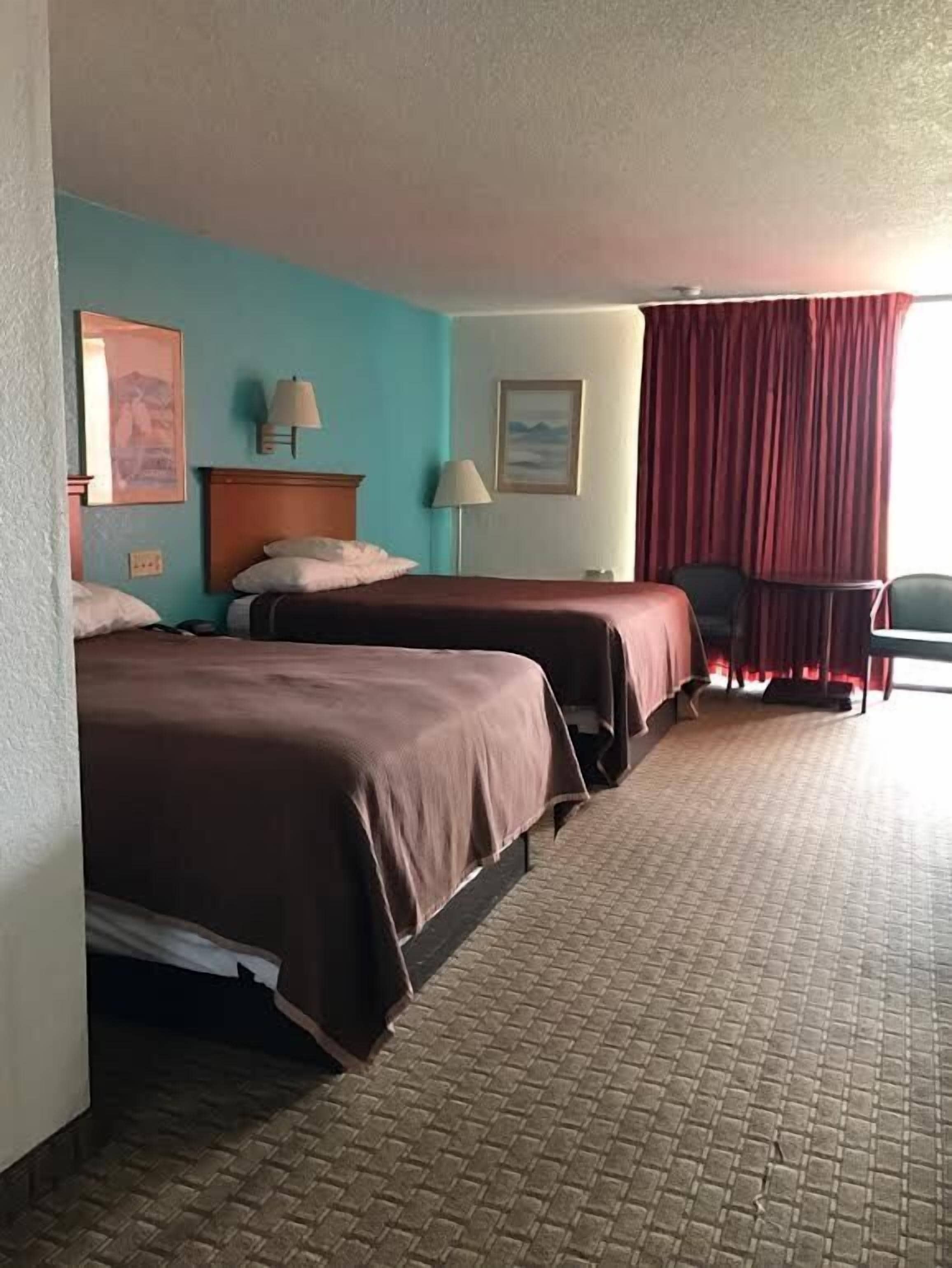 Room, 2 Queen Beds, Smoking | Blackout drapes, iron/ironing board, free cribs/infant beds