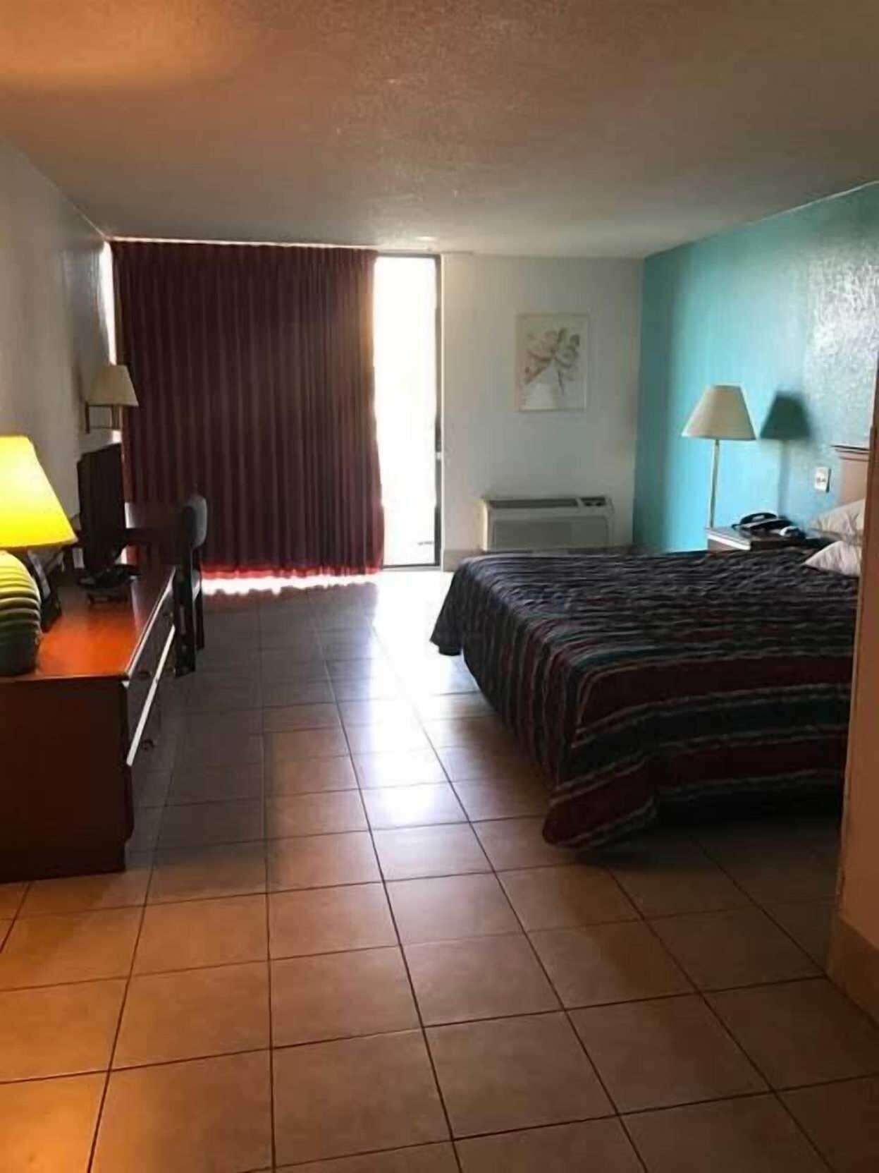 Blackout drapes, iron/ironing board, free cribs/infant beds