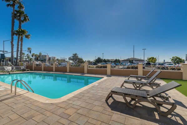 Outdoor pool, open 9:00 AM to 10:00 PM, pool umbrellas, pool loungers