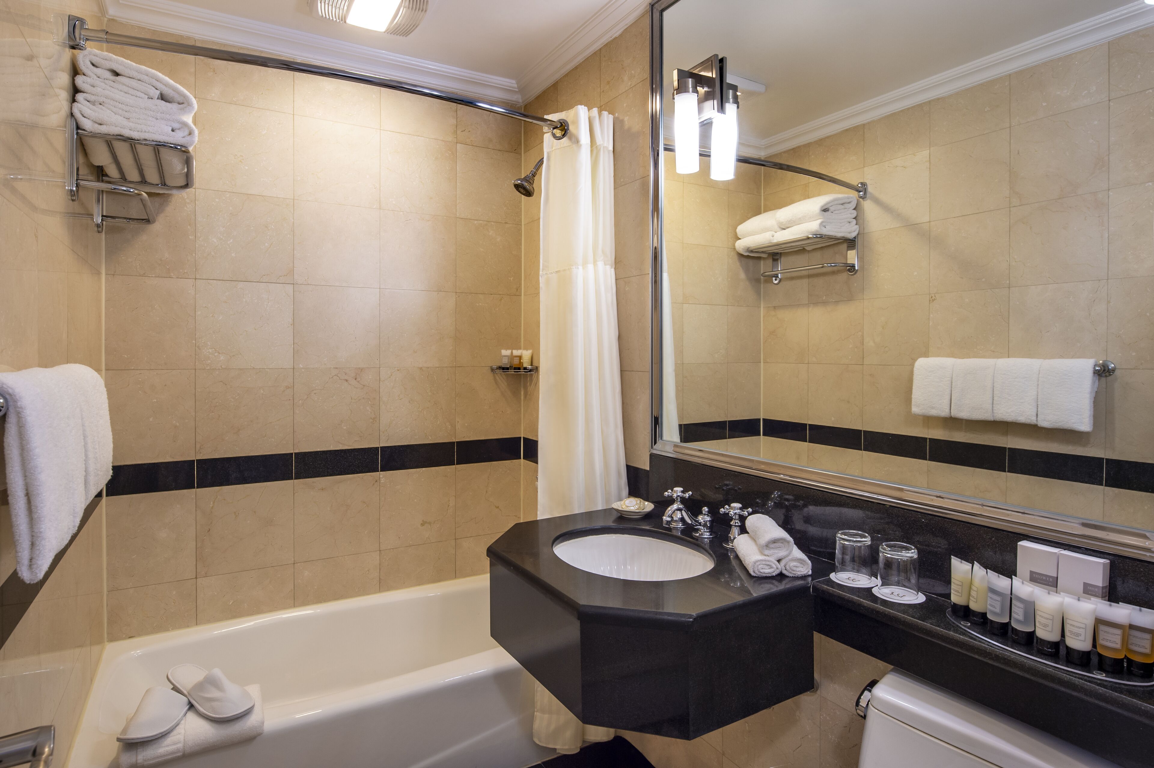 suite, 1 bedroom (on the avenue) | bathroom | combined shower/bathtub, designer toiletries, hair dryer, towels