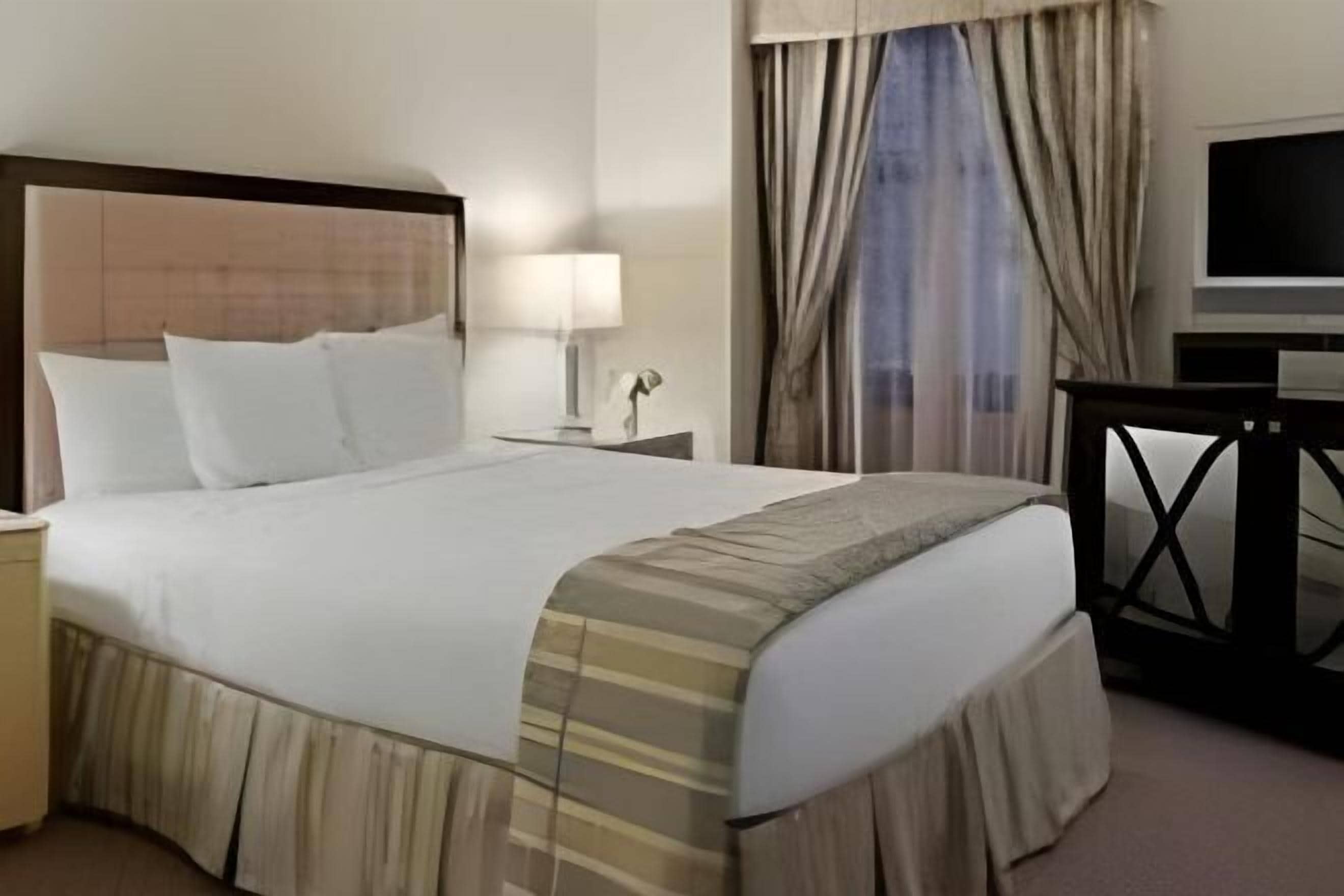 Premium bedding, down comforters, in-room safe, desk