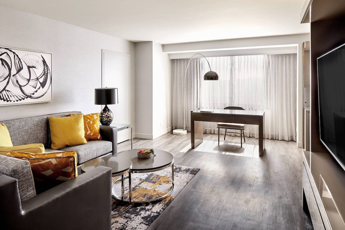 luxury suite, 1 bedroom, city view | living room | 47-inch flat-screen tv with cable channels, tv, netflix