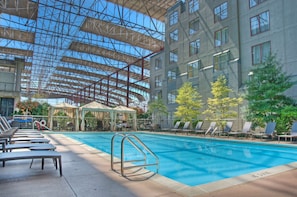 Seasonal outdoor pool, open 10:00 AM to 8:00 PM, pool loungers