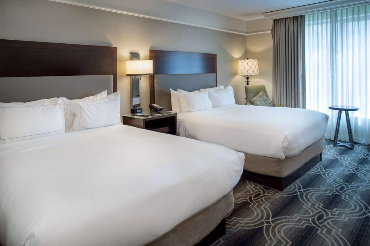 executive room, 2 queen beds, non smoking, courtyard view | premium bedding, in-room safe, laptop workspace, blackout curtains