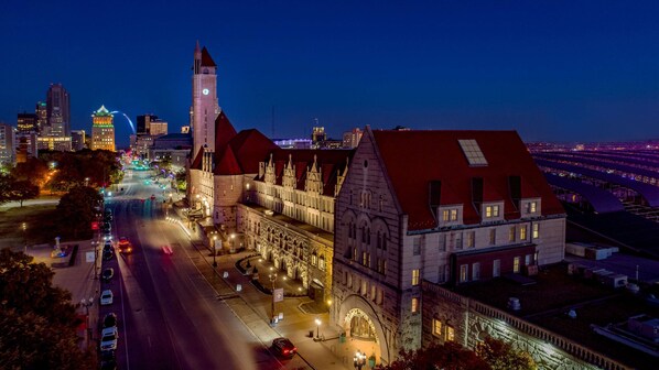A historic building with a clock tower, large windows, and a red roof. - St. Louis Union Station Hotel, Curio Collection by Hilton (St. Louis)