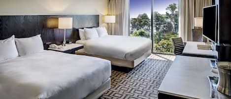 Hypo-allergenic bedding, down comforters, pillowtop beds, in-room safe
