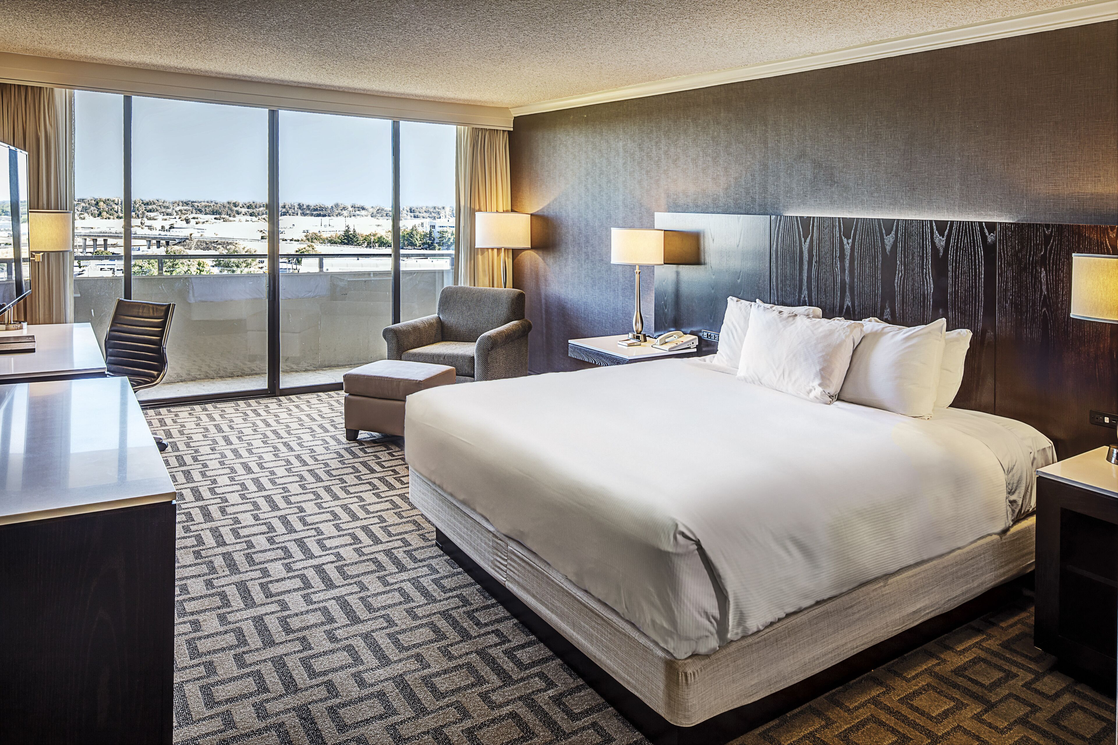 Hypo-allergenic bedding, down duvets, pillow-top beds, in-room safe