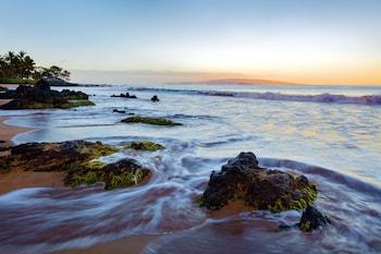 On the beach, white sand, beach cabanas, sun loungers at Fairmont Kea Lani Maui