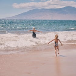 On the beach, white sand, beach cabanas, sun loungers