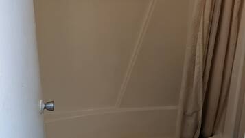 Shower, eco-friendly toiletries, towels, toilet paper