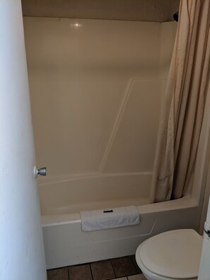 Shower, eco-friendly toiletries, towels, toilet paper