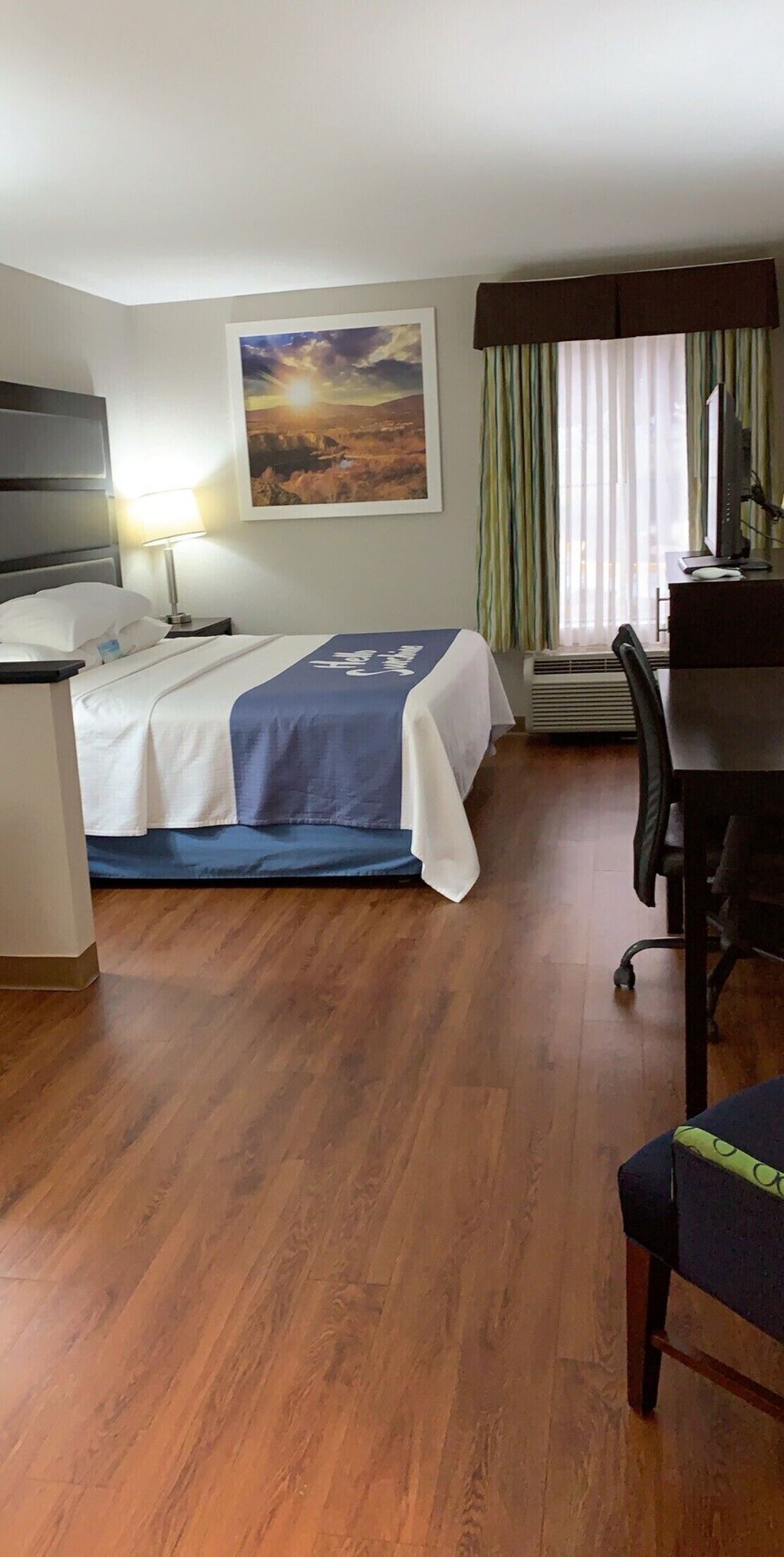 Desk, laptop workspace, iron/ironing board, free cribs/infant beds