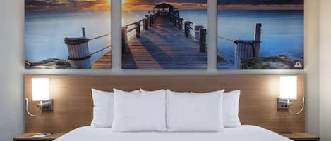 Desk, laptop workspace, iron/ironing board, free cribs/infant beds