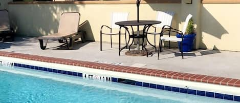 Seasonal outdoor pool, pool umbrellas, pool loungers