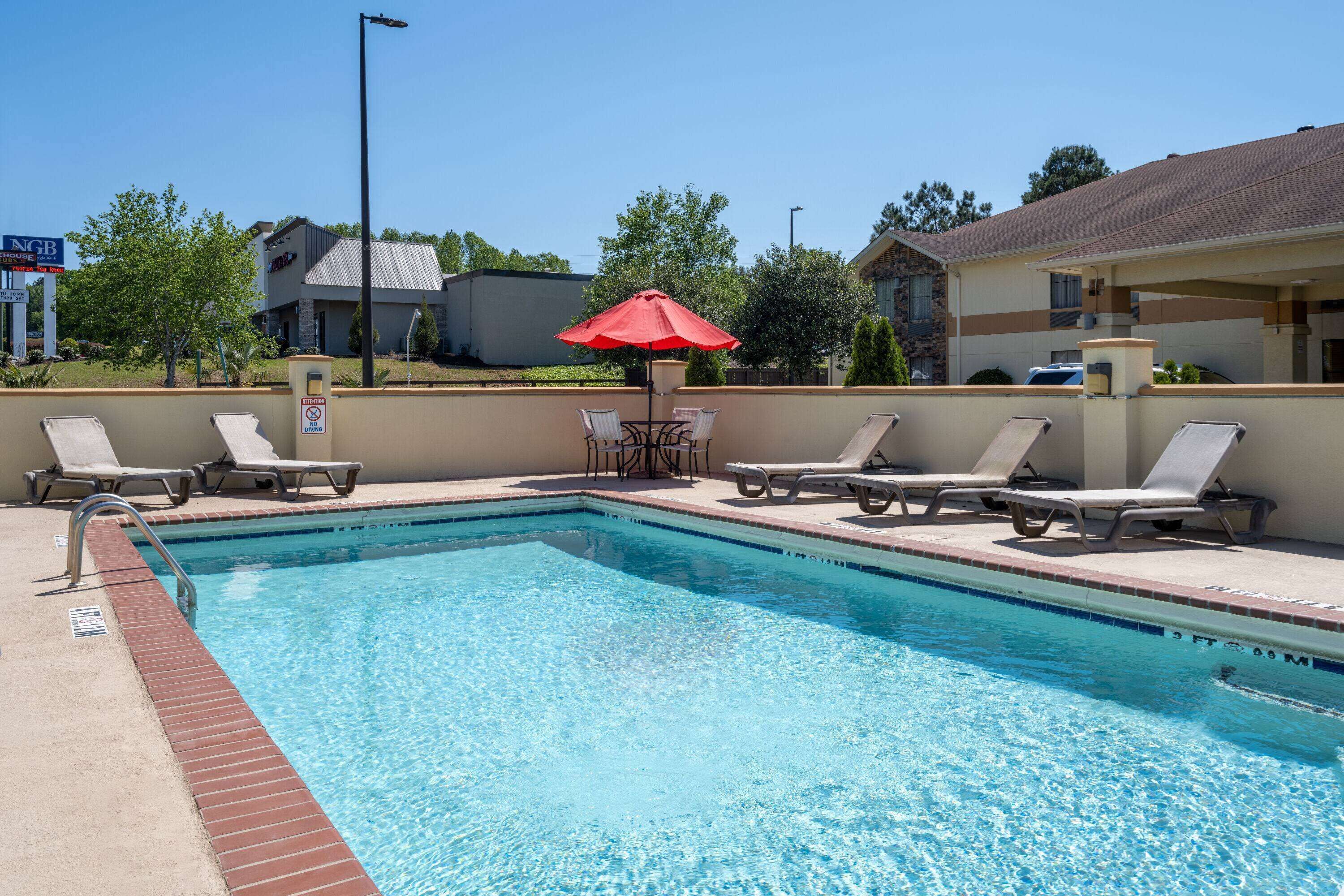 Seasonal outdoor pool, open 9:00 AM to 9:00 PM, pool umbrellas