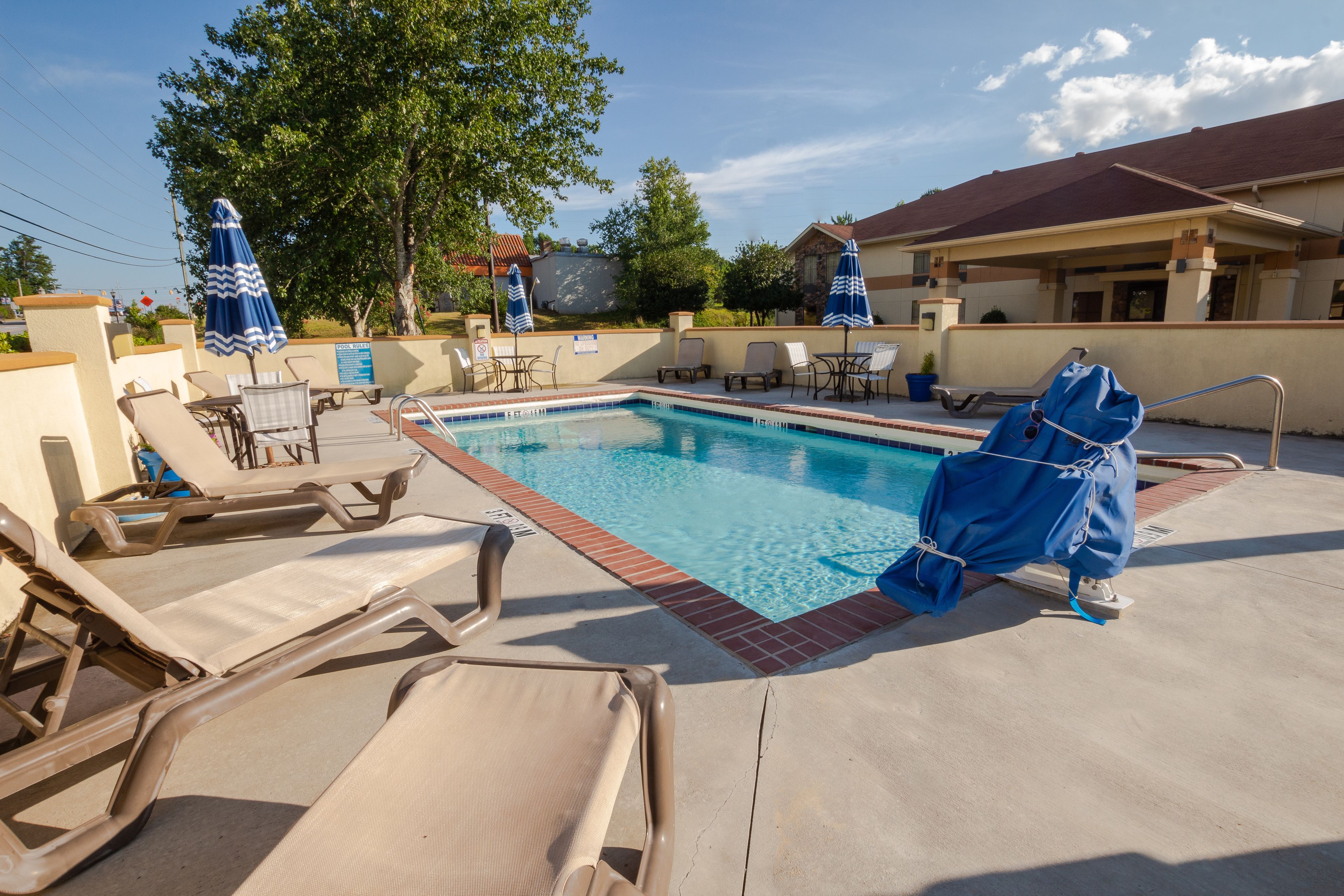 seasonal outdoor pool, open 9:00 am to 9:00 pm, pool umbrellas