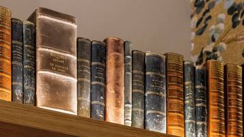 A wooden bookshelf filled with various books.