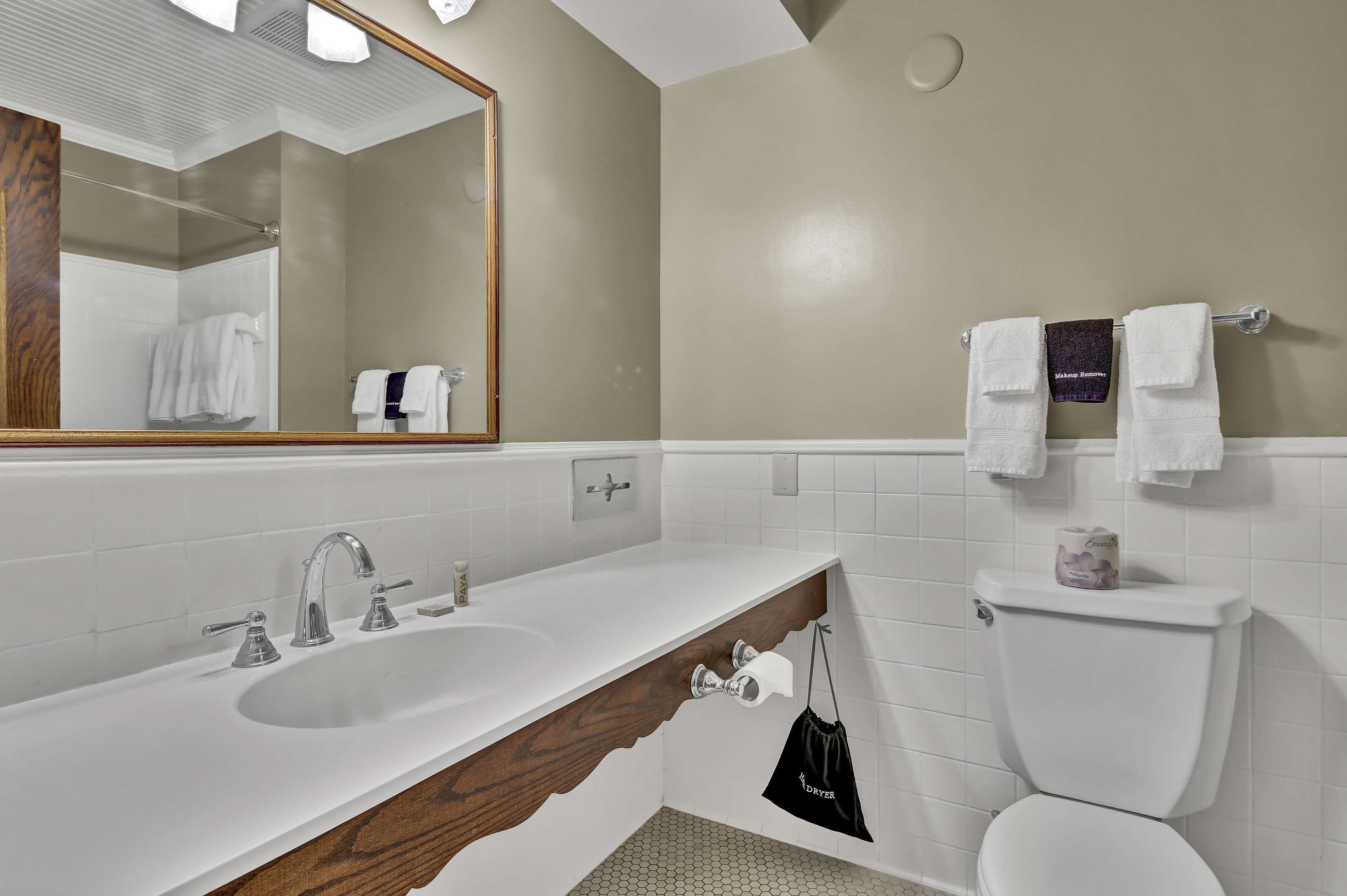 premium king riverside | bathroom | designer toiletries, hair dryer, bathrobes, towels