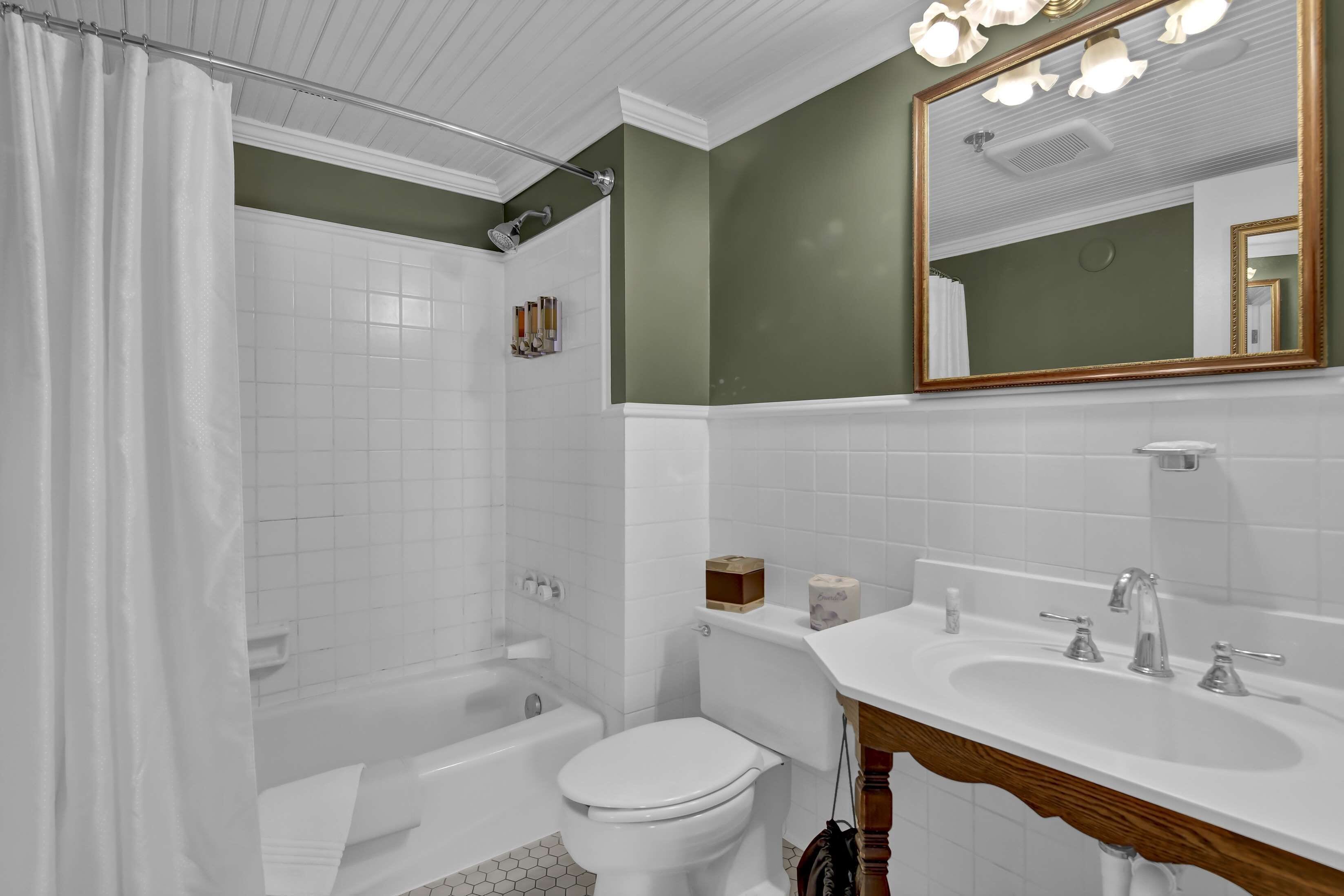 premium queen riverside | bathroom | designer toiletries, hair dryer, bathrobes, towels