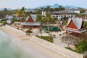 On the beach, white sand, beach umbrellas, beach towels