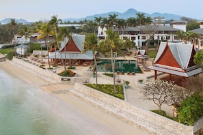 On the beach, white sand, beach umbrellas, beach towels