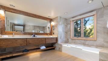 Separate bathtub and shower, designer toiletries, hair dryer, towels