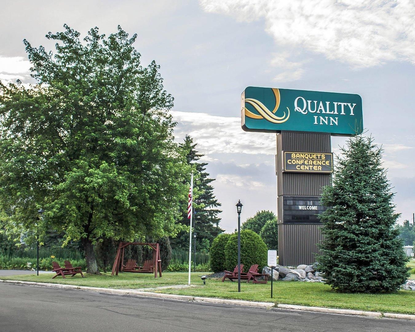 A Quality Inn sign with a Banquets Conference Center sign below it.