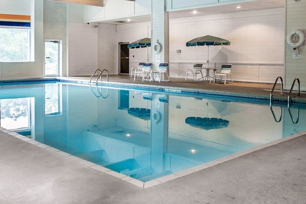 Indoor pool, open 7:00 AM to 10:00 PM, pool umbrellas, sun loungers