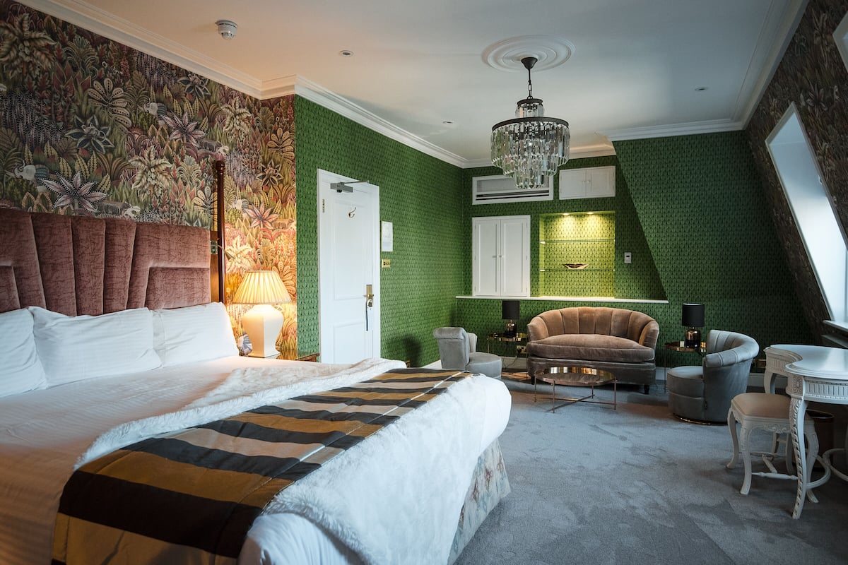 indulgent room | in-room safe, desk, laptop workspace, iron/ironing board