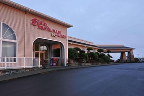 A building with a sign reading 'Shilo Restaurant & Lounge' and an entrance with a covered porch.