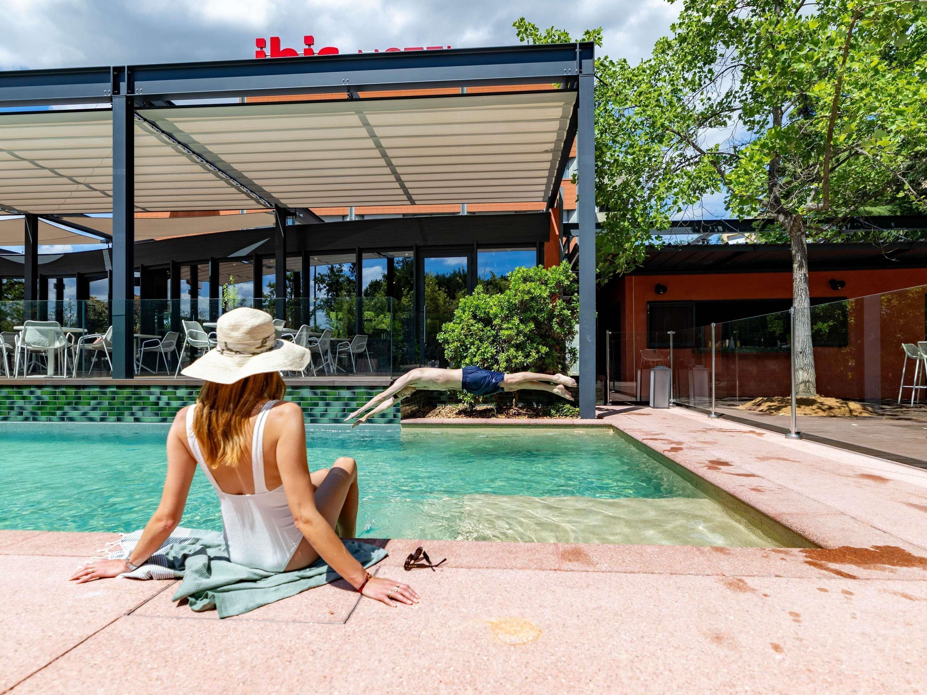 Outdoor pool, open 10:00 AM to 8:00 PM, pool loungers