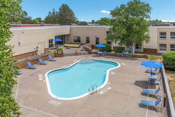 Seasonal outdoor pool, open 9:00 AM to 9:00 PM, pool umbrellas