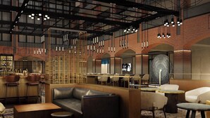 Een modern interieur met een bar, zitplaatsen en een kamerbreed tapijt.