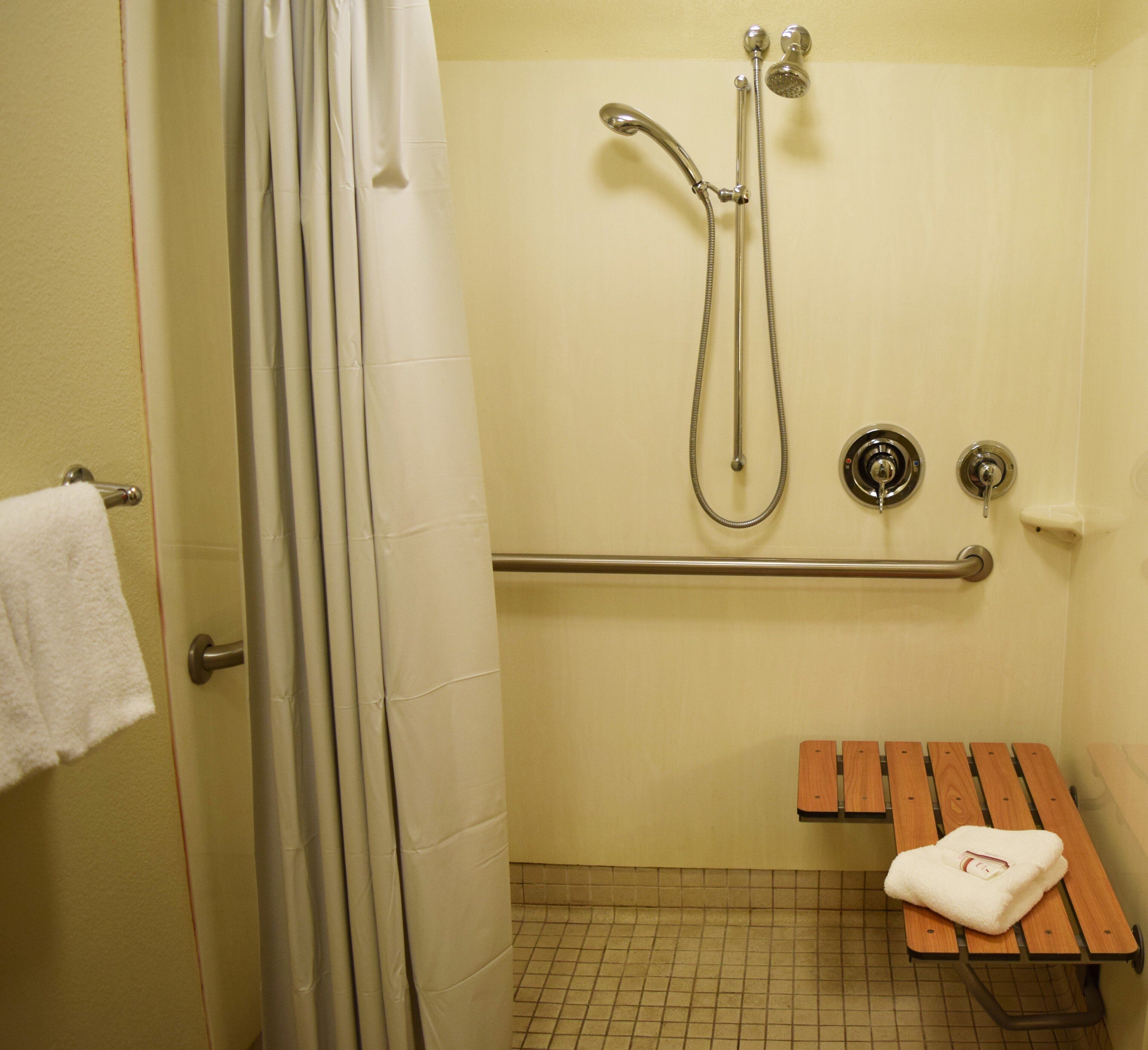 superior room, 1 king bed, accessible (roll-in shower, smoke free) | bathroom | combined shower/bathtub, eco-friendly toiletries, towels