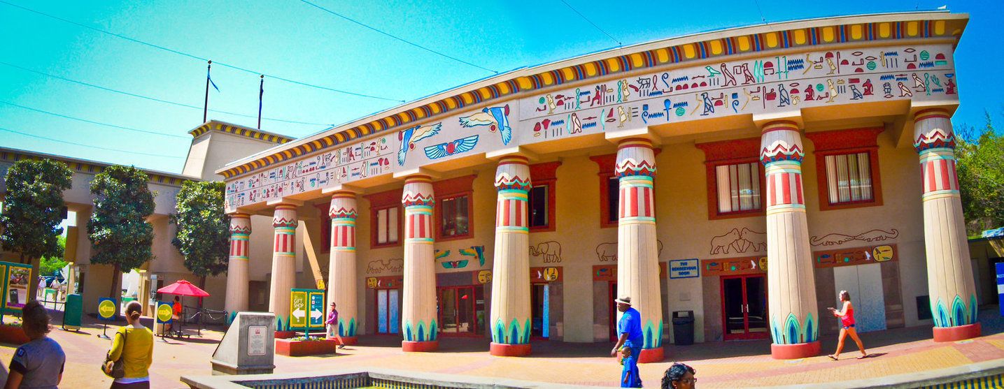 A building with columns and colorful Egyptian-style decorations.