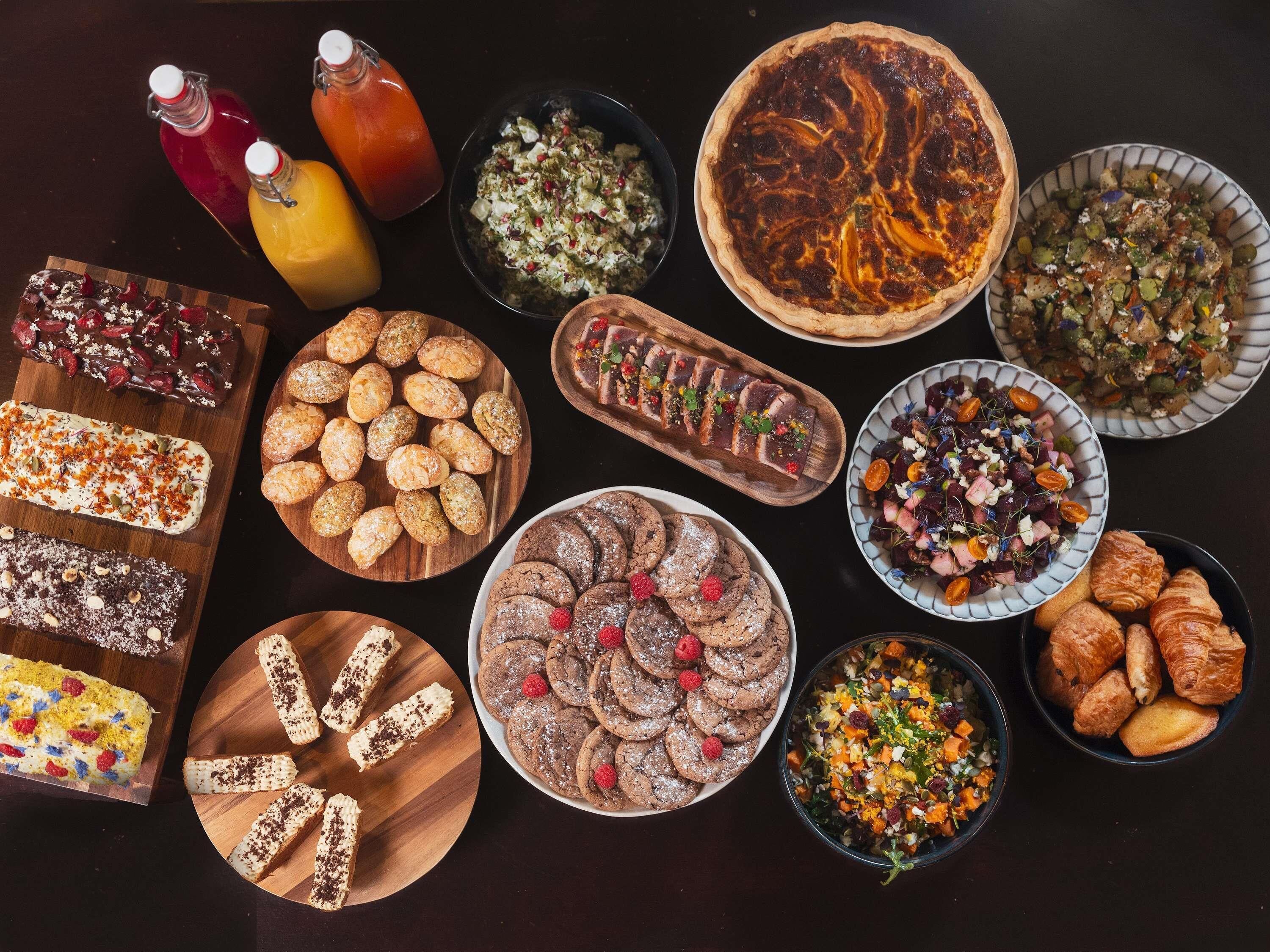 A variety of desserts and beverages on a table.