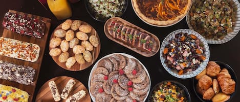 A variety of desserts and beverages on a table.