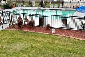 Outdoor pool, open 9:00 AM to 9:00 PM, pool umbrellas, pool loungers