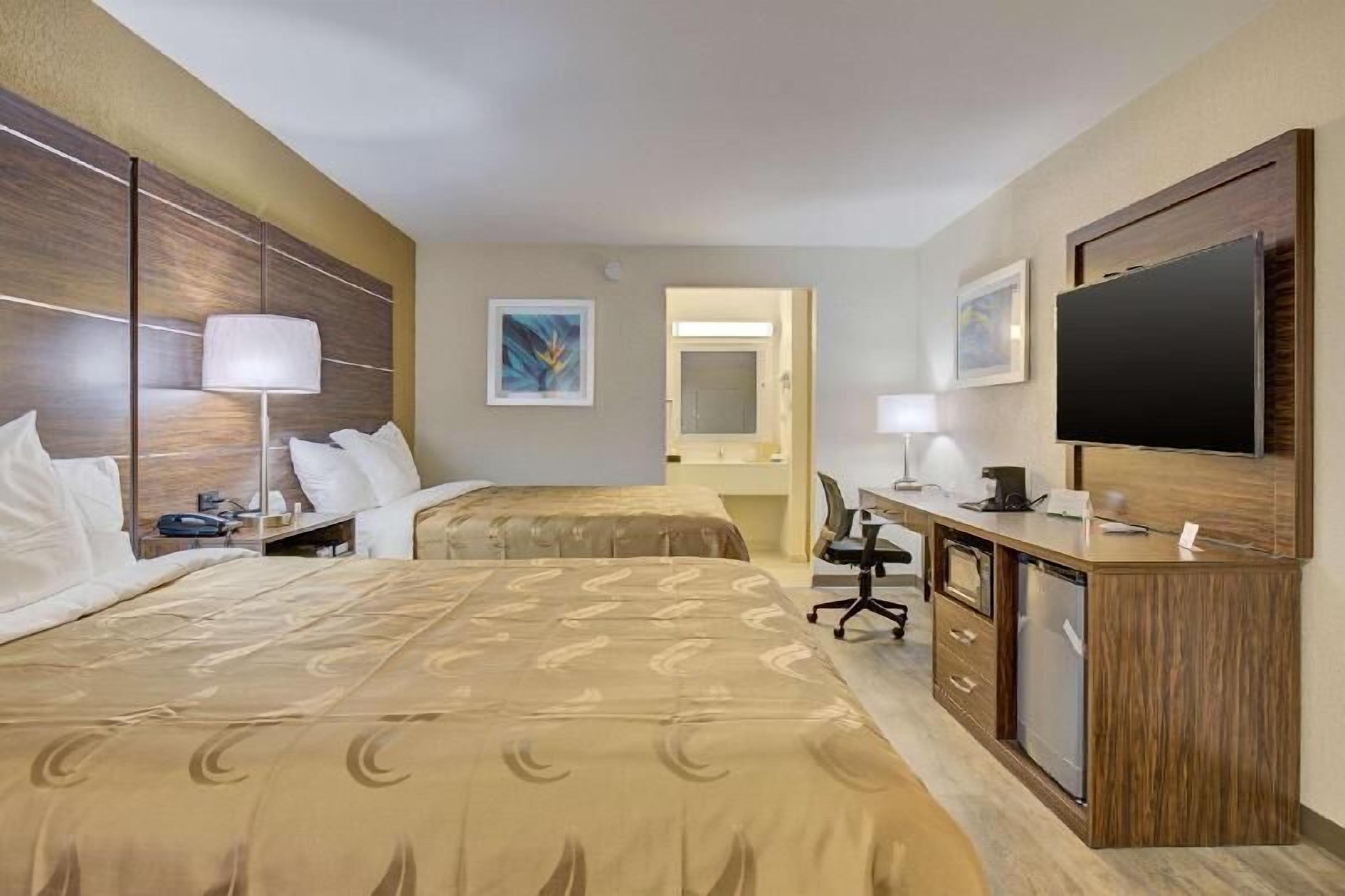 Down comforters, desk, laptop workspace, blackout drapes