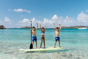 On the beach, white sand, sun-loungers, beach umbrellas