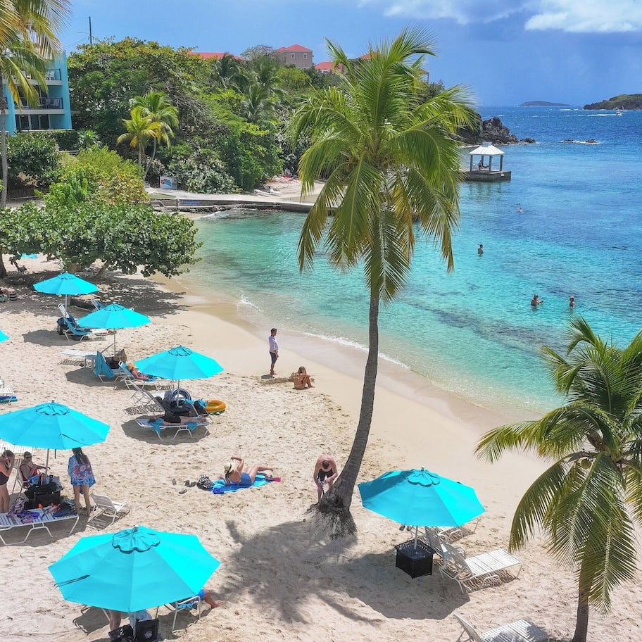 On the beach, white sand, sun loungers, beach umbrellas