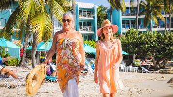 On the beach, white sand, sun-loungers, beach umbrellas