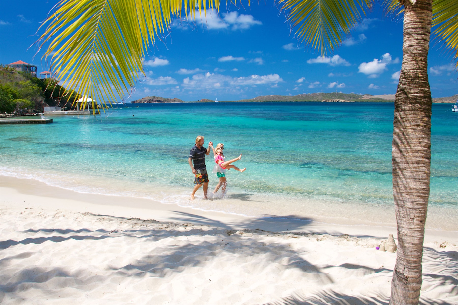 On the beach, white sand, sun loungers, beach umbrellas