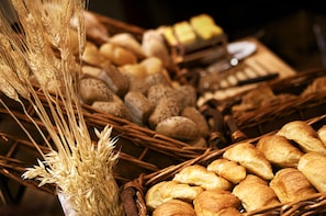 Baked goods are arranged in wicker baskets.