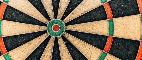 A dartboard with a central bullseye and multiple scoring rings.